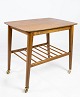 Side table with 
shelf and on 
wheels, in teak 
of danish 
design from the 
1960s. The 
table is in ...