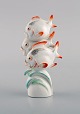 Willi Münch-Khe (1885-1960) for Meissen. Art deco figure in hand-painted 
porcelain. Three fish. 1930s.
