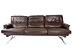 The 
three-seater 
sofa in brown 
patinated 
leather with a 
metal frame, 
designed by 
Arne Norell in 
...