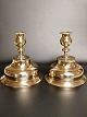 A pair of almost identical brass candlesticks from the early 1700s Height 15.5cm. diameter foot ...