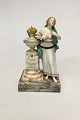 Royal 
Copenhagen 
Juliane Marie 
Figurine with 
Overglaze No 
12187. Woman 
with bare 
breast and ...