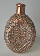 Antique whiskey 
bottle with 
copper 
decoration, 
19./20. C. 
Oriental work. 
The whole 
bottle is ...