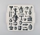 Arabia 
porcelain tray 
decorated with 
kitchen 
utensils. 
Finnish design, 
1960s / 70s.
Measures: ...