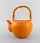 Kenji Fujita 
for Tackett 
Associates. 
Porcelain 
teapot with 
bamboo handle. 
Beautiful 
orange ...
