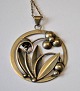 Silver pendant 
with plants, A. 
Klokker (1893 - 
1937) 
Kerteminde, 
Denmark. With 
silver chain. 
...