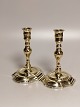 A pair of baroque brass candlesticks 18.Arh Profiled stem on oval base stamped Height 16cm. Foot ...