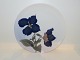 Bing & Grondahl 
plate decorated 
with flowers.
The factory 
mark tells, 
that this was 
produced ...