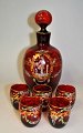 Venetian 
liqueur set in 
ruby red glass 
with enamel 
painting, 
approx. 1950, 
Italy. 
Compagnia ...