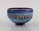 Sven Wejsfelt (1930-2009), Gustavsberg Studiohand. Unique bowl on base in glazed 
ceramics. Beautiful glaze in shades of blue. Dated 1992.
