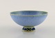 Sven Wejsfelt (1930-2009), Gustavsberg Studiohand. Unique bowl on base in glazed 
ceramics. Beautiful glaze in light blue and green shades. Dated 1984.
