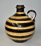 Humlebæk 
pitcher, 20th 
century 
Denmark. With 
yellow and 
brown glazes. 
With geometric 
...
