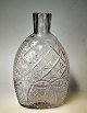 Pocket lark, 
clear glass, 
Conradsmide, 
pear-shaped, 
1/4 pot, 
approx. 1850. 
Denmark. 
Cutting ...