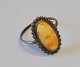 Silver ring 
with polished 
milk amber, 
1920 - 1930. 
Denmark. 
Stamped. Size: 
54.