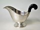 Silver sauce 
jug, hammered, 
1929, Cohr, 
Fredericia, 
Denmark. With 
wooden handle. 
Stamped. Weight 
...
