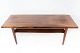 Coffee table in 
rosewood with 
shelf, of 
Danish design 
from the 1960s. 
The table is in 
great ...