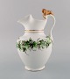 Antique Bing & 
Grøndahl 
chocolate jug 
in porcelain 
modeled with a 
lion on the 
handle. ...