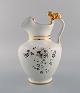 Antique 
Gustafsberg 
chocolate jug 
in porcelain 
modeled with a 
lion on the 
handle. 
Hand-painted 
...
