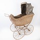 Antique child 
carriage of 
paper cord and 
metal wheels, 
from around the 
1930s.
H - 129 cm, W 
- ...