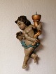 Baroque putti 
of painted wood 
Length 46cm. 
Appears with 
age-related 
traces of use.