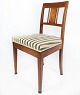 Dining room chair of mahogany with inlaid wood and upholstered with striped 
fabric from the 1920s.
5000m2 showroom.
