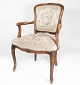 New rococo armchair of light wood and upholstered with light fabric, in great antique condition ...