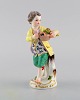 Antique Meissen 
porcelain 
figurine. Boy 
with flower 
basket. Model 
149. Approx. 
1900.
Measures: ...