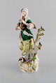 Antique Meissen 
porcelain 
figurine. Woman 
playing flute. 
Late 19th 
century.
Measures: 24.5 
x 12 ...