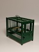 Green painted 
birdcage made 
of wood and 
iron lattice 
Height 20cm 
Length 24cm 
Width 14cm.