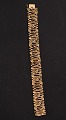 14 carat gold 
bracelet L. 
18.5 cm. B. 
1.75 cm. 
stamped 585 BH 
for jeweler 
Bernhard Hertz 
Kbh. ...