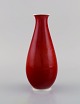 Thorkild Olsen 
for Royal 
Copenhagen. 
Vase in red and 
white 
porcelain. 
1920s.
Measures: 18.5 
x ...