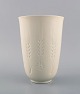 Royal 
Copenhagen 
blanc de chine 
vase with 
flowers and 
corn tassels in 
relief. Model 
number 4162. 
...