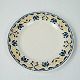 Lunch plate 
decorated with 
yellow and blue 
colours from 
the 1960s. We 
have 12 in 
stock. 
16 cm.