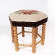Stool of light 
wood and 
upholstered 
with 
embroidered 
fabric from the 
1970s. The 
stool is in ...