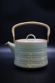 Jens Harald 
Quistgaard - 
Rune Nissen / 
Bing & Grondahl 
stoneware.
Teapot with 
wicker handle: 
H: ...