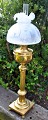Large petroleum 
lamp, approx. 
1900, Denmark. 
Square foot 
with four ball 
legs. Profiled 
stem. ...
