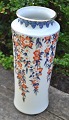 Japanese 
porcelain vase. 
20th century. 
Decorated in 
imari technique 
with floral 
ranks and ...