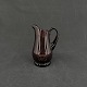 Height 10.5 cm.
The creamer is 
mouth blown and 
with an 
attached 
handle. It has 
a so-called ...