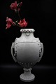 Decorative French 1800 century vase / urn in white porcelain with handles and 
floral decorations...