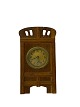 Fireplace clock of oak and the dial is of brass, from around the 1920s. The clock is in good ...
