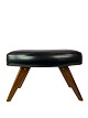 This stool, 
with its black 
artificial 
leather and 
teak legs, 
represents a 
classic piece 
of ...