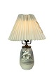 Royal 
Copenhagen 
porcelain lamp 
with floral 
motif and paper 
shade. 
46 x 12 cm.
