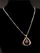 8 carat gold 
necklace 46 cm. 
and pendant 2.5 
x 2.5 cm. with 
amethyst 
stamped BH for 
jeweler B ...