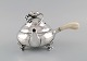 Georg Jensen 
Blossom teapot 
in hammered 
sterling silver 
with ivory 
handle. Model 
2C. Dated ...