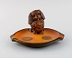 Ipsen's, 
Denmark. Bowl 
in hand-painted 
glazed ceramics 
modeled with 
Pekingese. 
1920s / 30s. 
...
