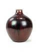 Ceramic vase 
with ox-blood 
coloured glaze 
by Kresten 
Bloch for Royal 
Copenhagen. The 
vase is in ...
