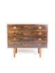 This chest of 
drawers in 
rosewood, 
designed by 
Danish 
furniture 
architects in 
the 1960s, is a 
...