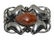 Danish 
sterlingsilver 
brooch in Art 
Nouveau style 
with amber by 
Henry Andersen 
from 1933 to 
...