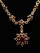 Gold plated necklace 45 cm. with pendant  D. 1.6 cm. with garnets item no. 475279