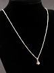 14 carat white 
gold necklace 
42 cm. and 
pendant with 
diamond approx. 
0.10 carat item 
no. 477058