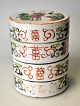 Chinese food 
container in 
porcelain, 19th 
century. Family 
rose. Sides 
decorated with 
signs, ...